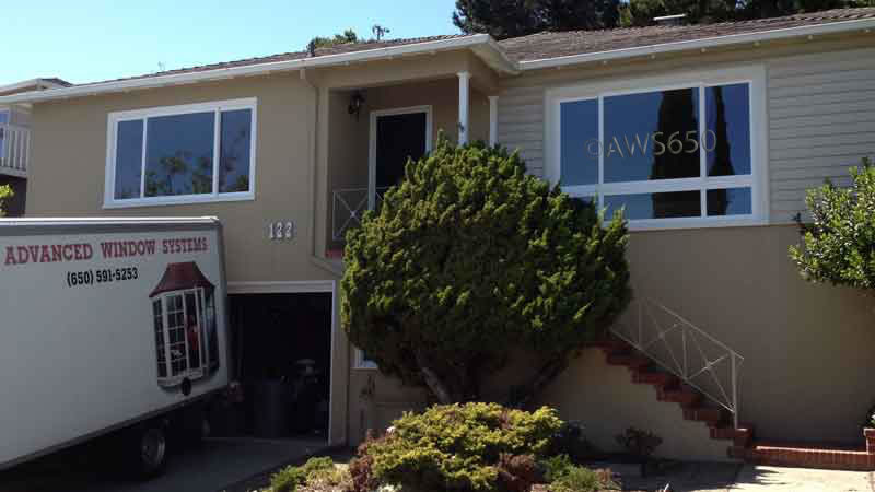 Milgard vinyl replacement windows installed in aluminum siding.